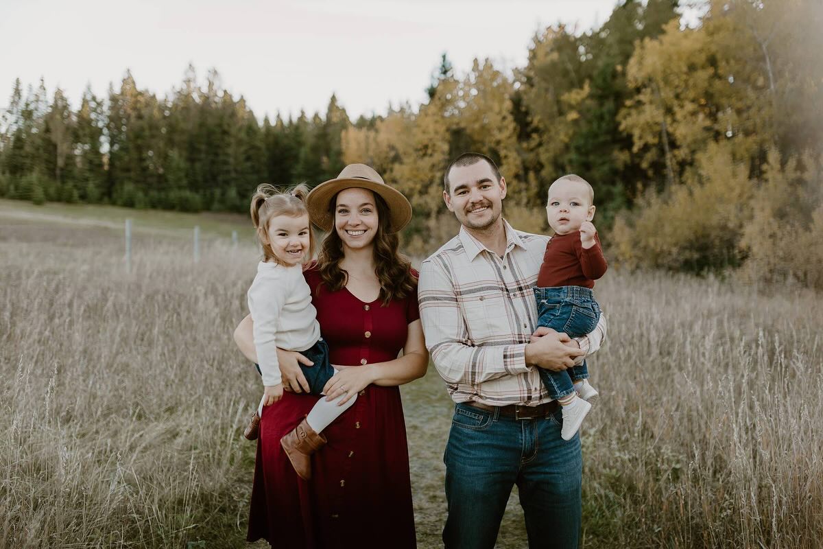 The Lee family in a field near Red Deer, Alberta